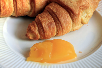 Fresh croissant and lemon curd
