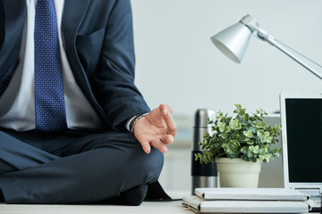 Meditating businessman