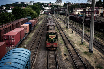 Fototapeta na wymiar Long trains of freight cars and the locomotive