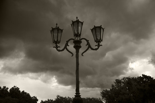 Old street lamp on a background of the dark sky.