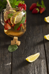 cocktail with fresh fruits, berries and mint