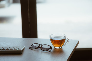office workplace keyboard and coffee cup  on office work table in working  business