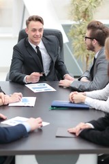 businessman at a meeting with employees