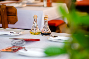 Olive oil and spices on the table in the restaurant