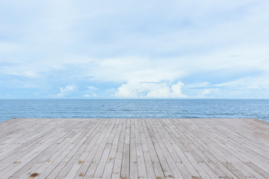 Fototapeta empty wood deck pier with sea ocean view background calm and tranquil