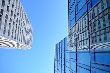 Blue clean glass wall of modern skyscraper