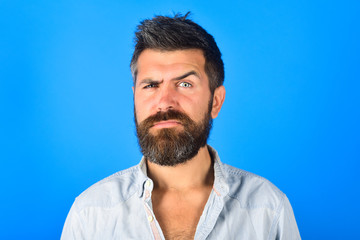 Serious man. Serious bearded man looking at camera. Man with long beard and mustache with serious face expression. Feeling and emotions. Close Up. Emotions. Feelings. Facial expressions concept.