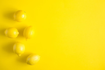 Yellow background. Lemon fruit. Flat lay, top view, copy space 