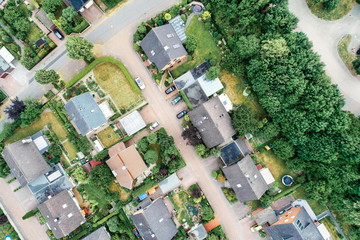 Vertical aerial view of a suburban settlement in Germany with detached houses, close neighbourhood...