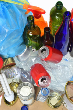 garbage consisting of cans, plastic bottles, glass bottle, carton, tetrabrik, cans and bulb