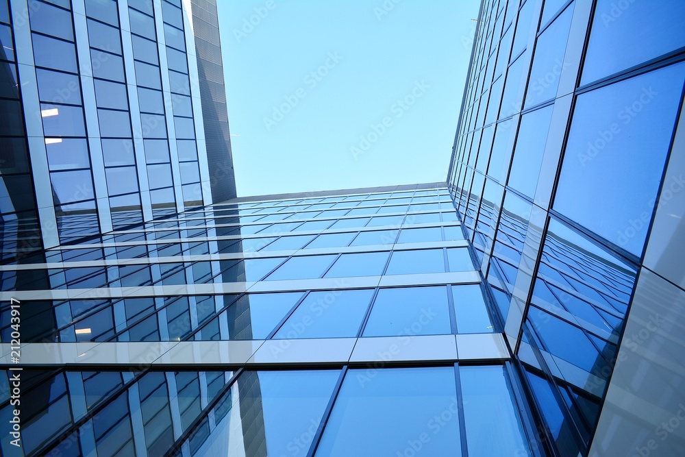 Wall mural blue clean glass wall of modern skyscraper