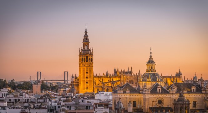 View of La Giralda and Iglesia del Salvador at sunset, bell tower of the Cathedral of Seville, Catedral de Santa Maria de la Sede, Seville, Andalusia, Spain, Europe