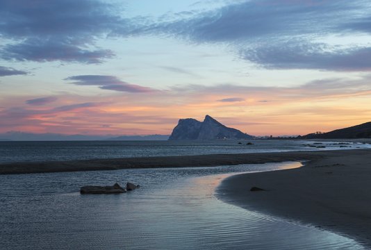 View of The Rock of Gibraltar and La Linea de la Concepcion as seen from the Mediterranean coast at sunset, Cadiz, Andalusia, Spain, Europe