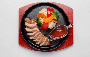 fried duck with vegetables and sauce
