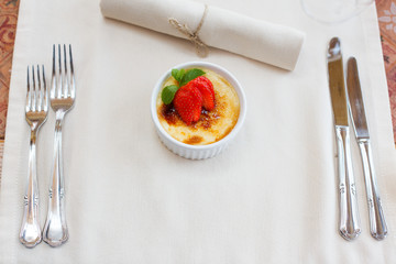 cream brulee with strawberry and mint