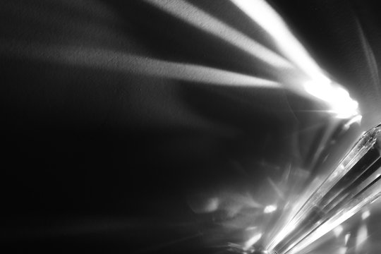 Rays emitted from crystal on black background