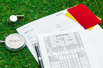 two penalty cards and a whistle for the referee