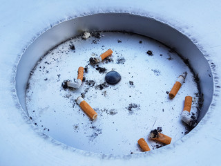 Cigarette butts, Cigarette butts discarded in ashtray, Smoking is bad for body health, unhealthy concept.