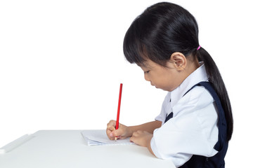 Asian Chinese little girl wearing school uniform studying