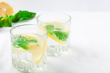 Basil lemon water. Drink infused water cocktail. Healthy lifestyle concept. Copy space