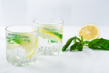 Basil lemon water. Drink infused water cocktail. Healthy lifestyle concept. Copy space