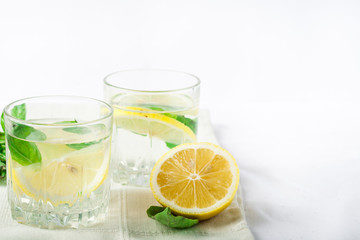 Basil lemon water. Drink infused water cocktail. Healthy lifestyle concept. Copy space