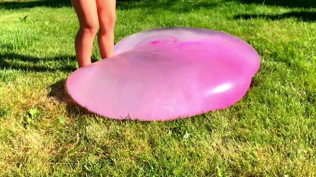 Bubble Wubble ball filled with water, slow motion play