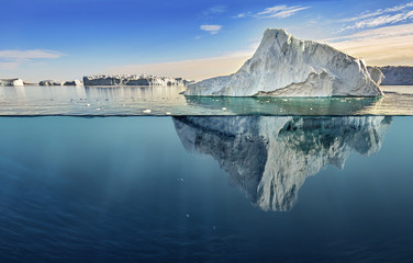 iceberg with above and underwater view