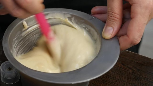 process of mixing of components for reception without an aldehyde paint in a beauty salon. 4K