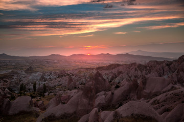 Fototapeta na wymiar Unreal landscape of Cappadocia. Colorful sunset in valley. G reme National Park of Turkey, background