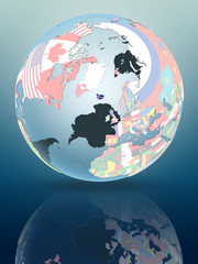 Obraz premium Iceland on globe with flags