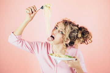 Sexy girl eating noodles. Morning breakfast. Girl hold plate of spaghetti. Attractive woman eating noodle. Adorable woman with curly hair eating pasta. Fashion and beauty. Diet, food, meal, Italy.