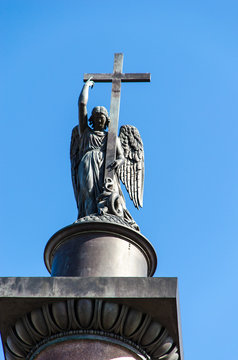 Angel on the Alexander Column against a against the blue sky . St. Petersburg