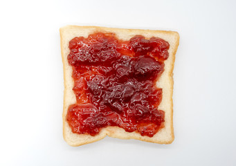 homemade slide bread with strawberry jam isolated on white