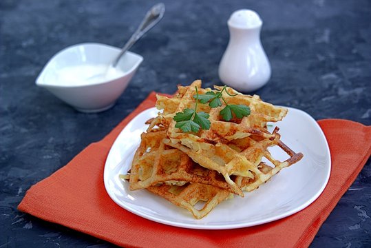Crispy waffle hash browns or pancakes from shredded potatoes. Served with sour cream