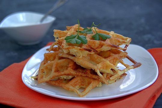 Crispy waffle hash browns or pancakes from shredded potatoes. Served with sour cream