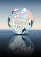 Lebanon on globe with flags above water