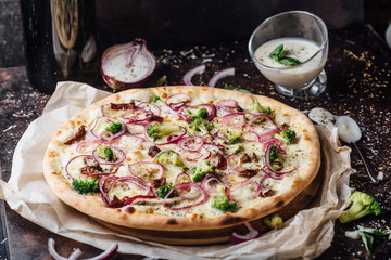 Broccoli pizza with sour cream sauce