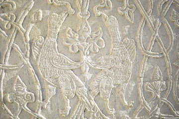 the relief of birds on the wall of the ancient cathedral