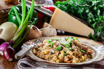 Risotto with champignon mushrooms, pork and parmesan