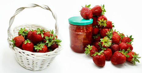 Red strawberries in the basket and on the table isolated on white background. 