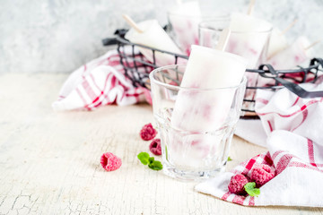 Summer sweet desserts, homemade organic ice cream popsicles from raspberry and yogurt,