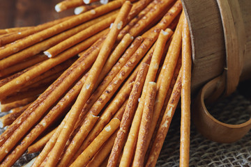Group of salted pretzel sticks scattered around the table