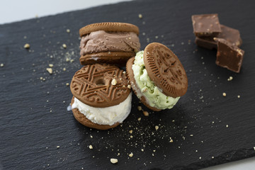 Homemade sandwiches with vanilla, pistachio and chocolate ice cream.