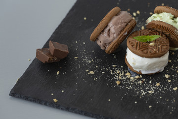 Homemade sandwiches with vanilla, pistachio and chocolate ice cream.