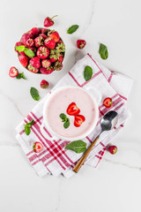 Obraz na płótnie Canvas Sweet creamy strawberry soup, vegan summer food, white marble background copy space
