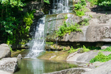 Naklejka premium Waterfall. Floating water over the rocks.