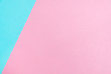 Pastel colored paper flat lay top view, background texture, pink and blue.