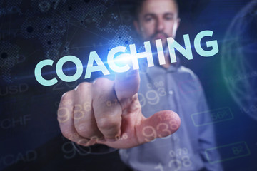 The concept of business, technology, the Internet and the network. A young entrepreneur working on a virtual screen of the future and sees the inscription: coaching