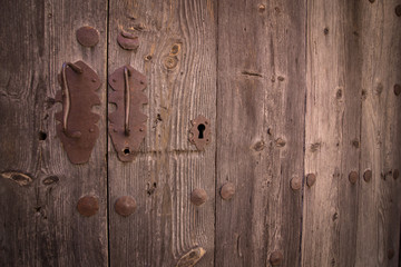 old door with rusty handles and lock close-up